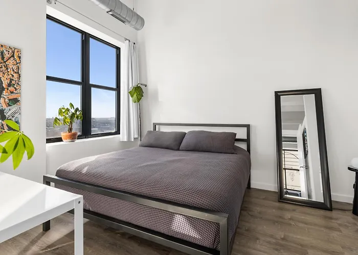 Modern Historic Loft 19ft Ceilings, Gym, Heated Parking, Skyline Views, Balcony