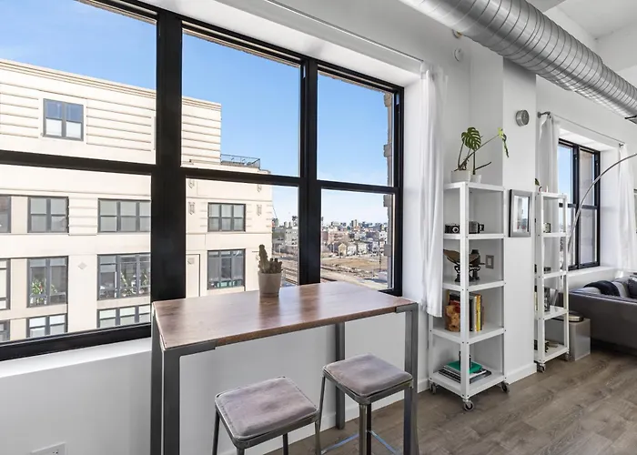 Modern Historic Loft 19ft Ceilings, Gym, Heated Parking, Skyline Views, Balcony *