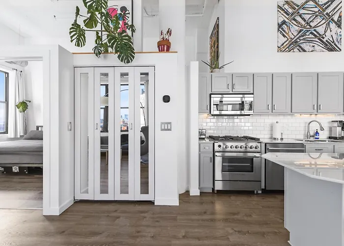 Modern Historic Loft 19ft Ceilings, Gym, Heated Parking, Skyline Views, Balcony *